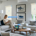 KALIA motorized bamboo roller shades in a bright modern living room