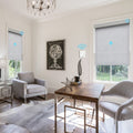 Motorized solar window shades providing light filtering in a bright living room