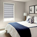 Gray-white striped zebra blinds in bedroom, calm sleeping space