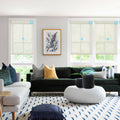 KALIA custom motorized solar shades installed on multiple living room windows