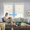 KALIA motorized linen roller shades in a modern living room with remote control