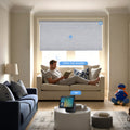 KALIA motorized blackout roller shades in a modern living room